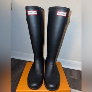 Used. Still in good condition. A few scuff marks and blemish’s. No holes.